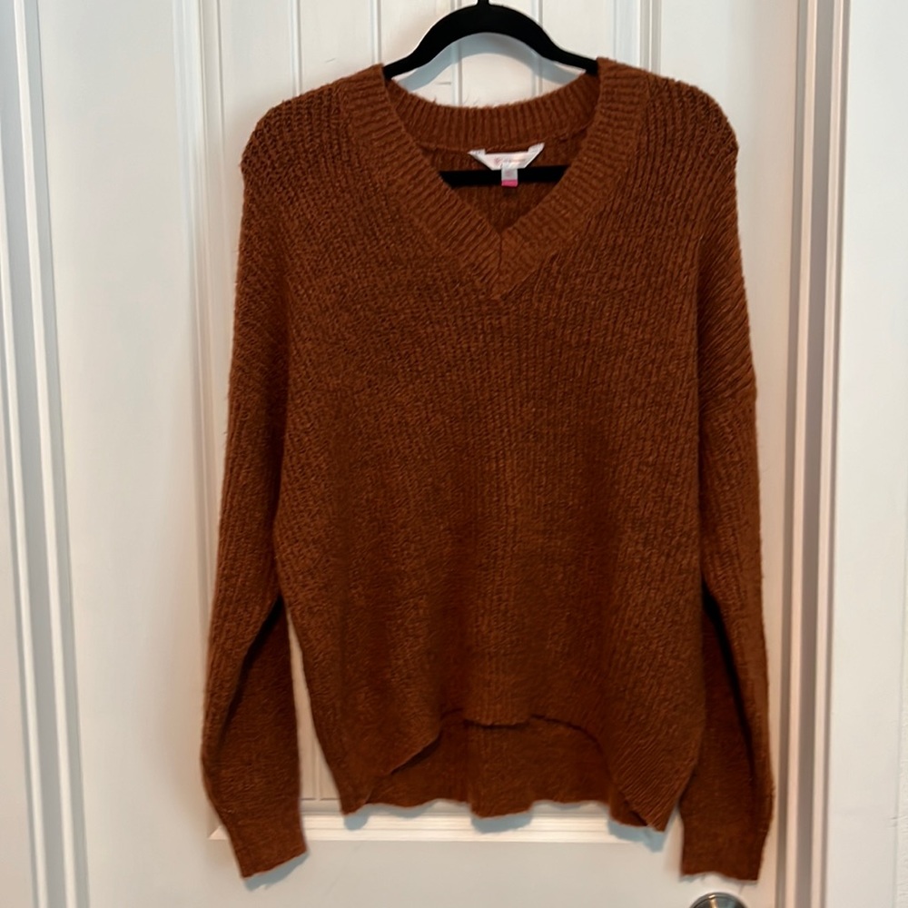 Beautiful soft rust v neck sweater with hints of black